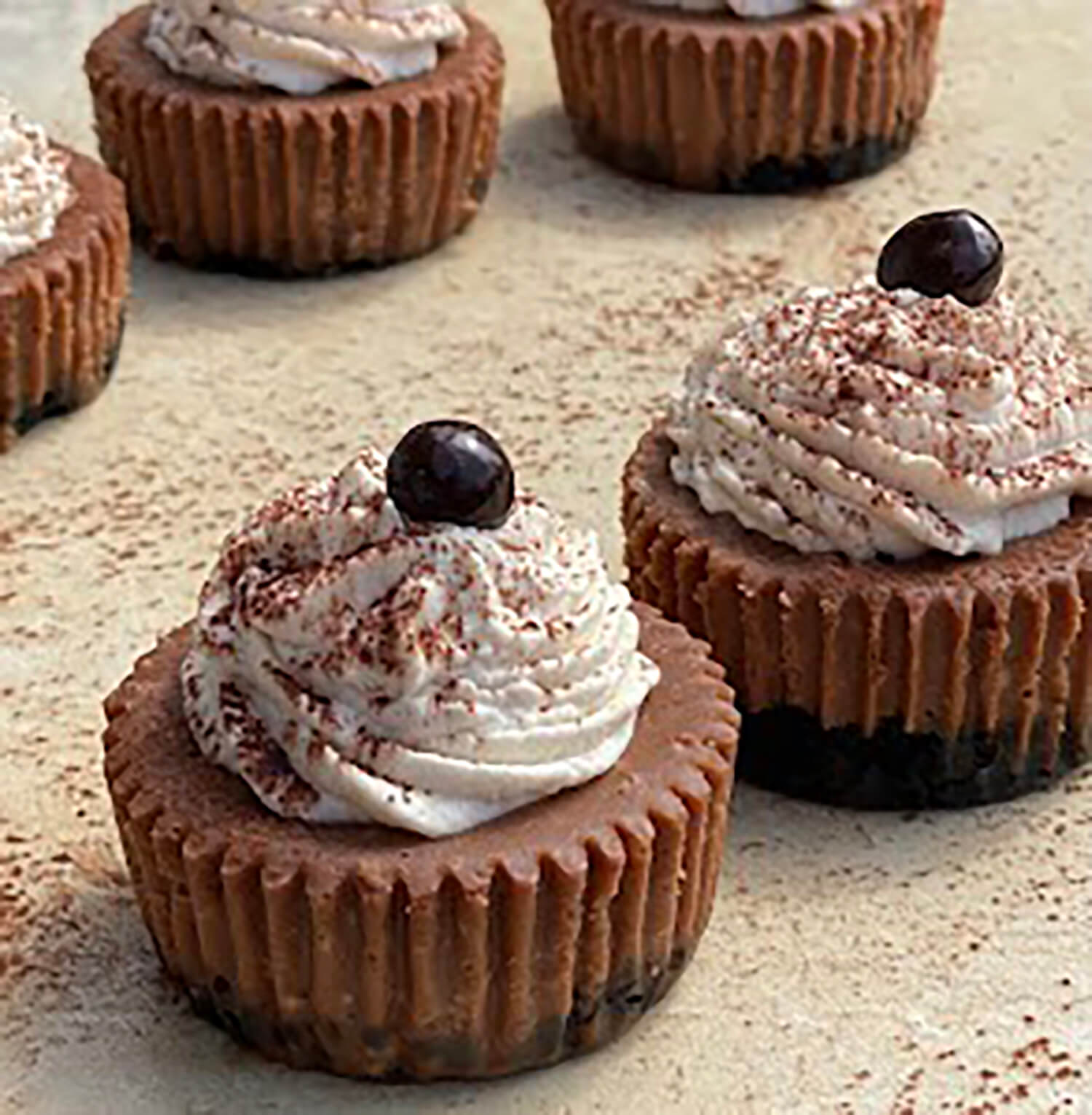 Mocha Madness - This cheesecake starts with an Oreo crust. The filling is flavored with chocolate and espresso. It is topped with a Mudslide whipped cream, cocoa powder, and a dark chocolate covered espresso bean.